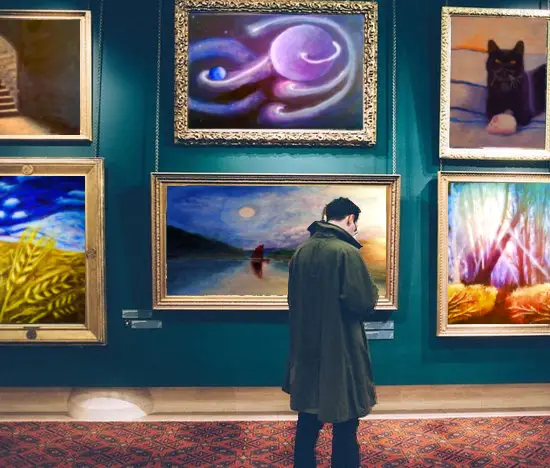 Man in gallery - Wendy Webster's paintings are hanging on the wall - Square size image